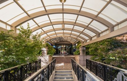Covered walkway leading to a Mansell Overlook building entrance